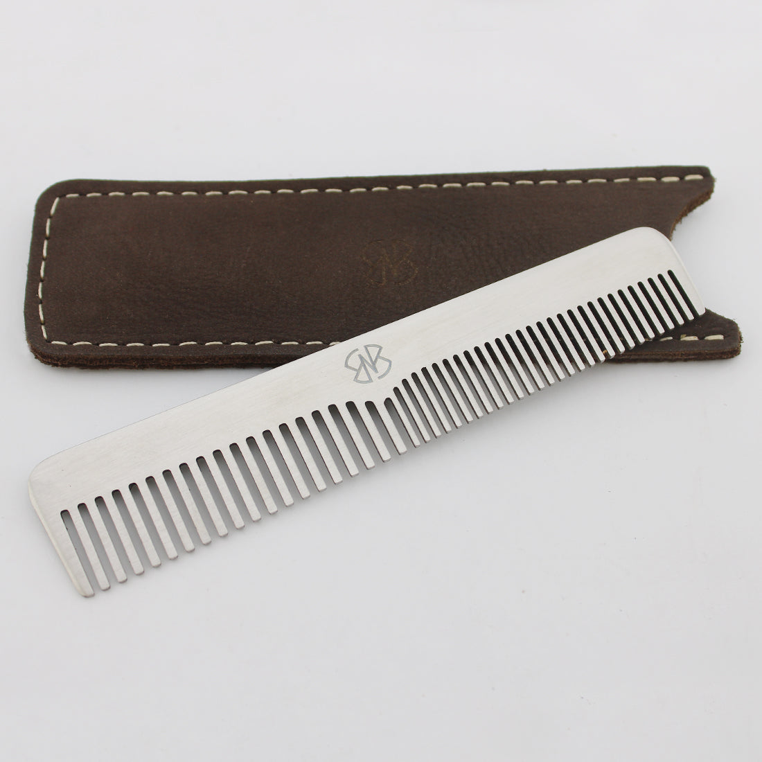 Stainless steel hair styling comb with dark brown leather pouch