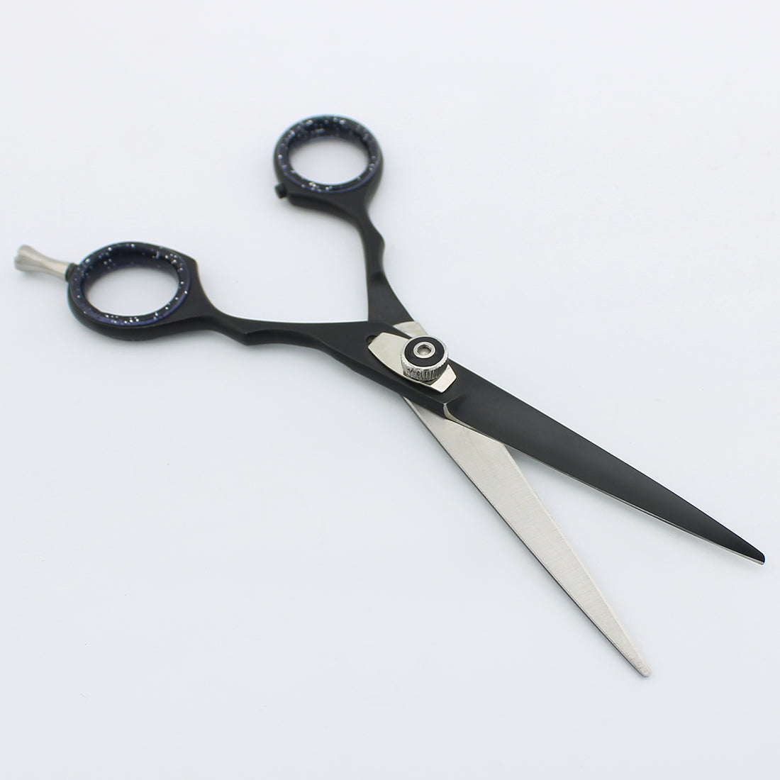 Black 6-inch hair cutting scissor opened to show blades and adjustable screws at BNB