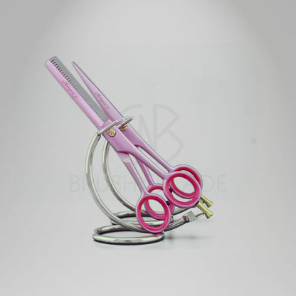 Pink 6-inch hairdressing scissors set demonstrating professional haircutting